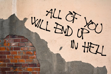 All Of You Will End Up In Hell - handwritten graffiti sprayed on the wall - damnation and religious punishment of sinful sinners because of sins and immorality - obrazy, fototapety, plakaty