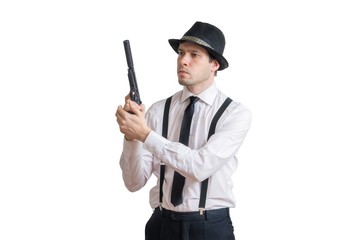 Young detective holds gun with silencer in hands. Isolated on white background.