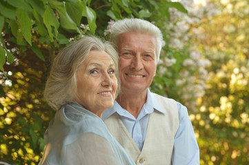 mature couple on  in summer park