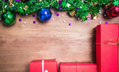 Christmas symbols colorful stars and colored bell with a wooden texture, freeing space for ideas...
