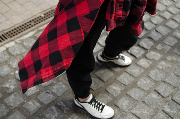 woman's legs in sport shoes