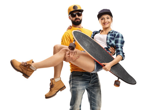 Bearded man carrying a female skater with a longboard