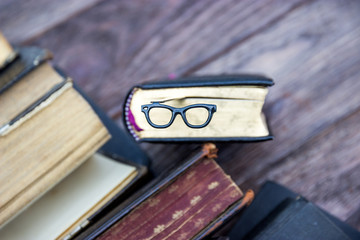 Vintage books and bookmark glasses