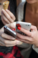 Two girlfriends are making selfie 