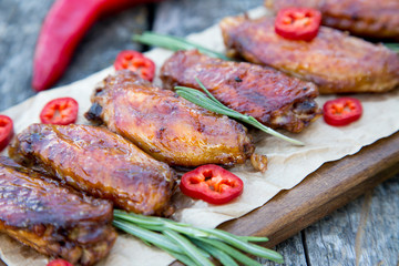 Baked spicy chicken wings in the Asian style