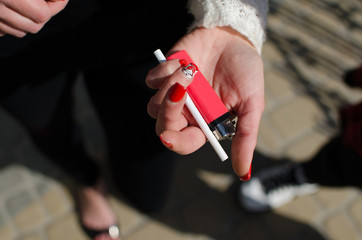 Young woman is smoking 