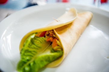 Asian style soft wrap on white plate