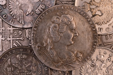 Vintage background silver coin Russian ruble in 1730 Empress Anna autocrat of all Russia