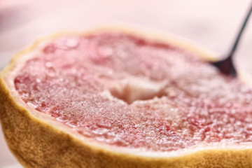Half of grapefruit sprinkled with sugar