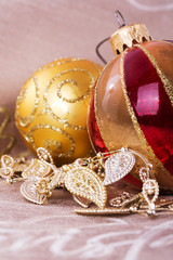 Festive gold Christmas decorations on fabric background