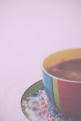 Hot chocolate in a bright colourful cup Vintage Retro Filter.