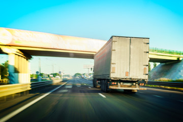 Truck driving on the highway. The motion, blur, transportation