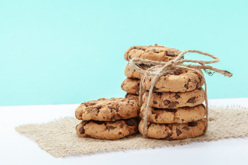 chocolate chunk cookies on a bright blue background