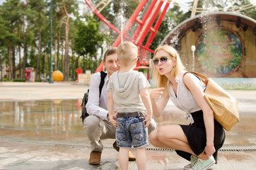 Young family is walking in the park