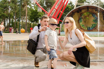 Young family is walking in the park