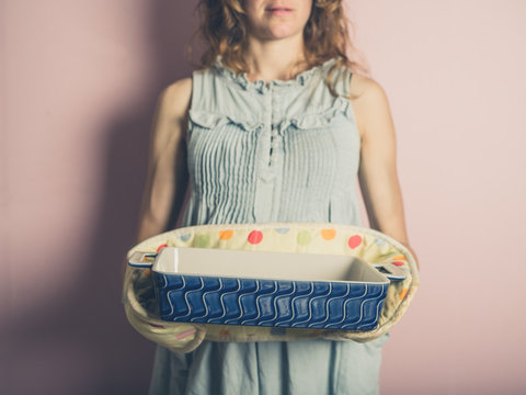 Woman with oven dish