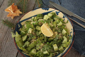 vegan healthy salad with bulgur, cucumber, avocado and crispy toast