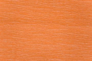 Fototapeta premium Brightly orange crumpled paper texture
