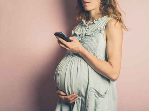 Pregnant woman with cell phone
