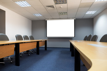 conference room with white mock up screen