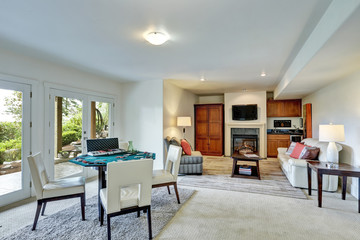 Entertainment room with poker table and cozy family area