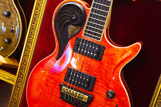 detail of beautiful red guitar