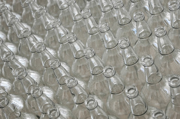 a large number of transparent glass bottle white closeup