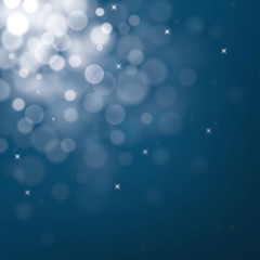 Decorative christmas background with blue bokeh lights