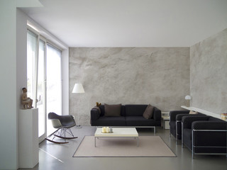 contemporary living room with rough cast wall and copy space for images