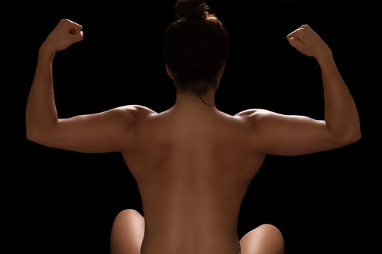 Female bodybuilder back portrait showing her muscles