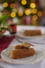 Fototapeta na wymiar Plate with croquette on Christmas table.