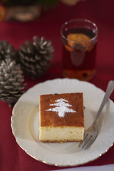 Powdered sugar shape on cheesecake piece