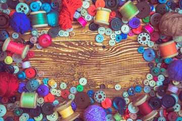 clothes buttons on wooden baclground