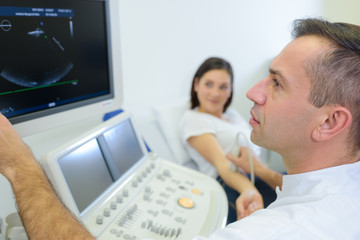 Fototapeta na wymiar Doctor scanning patient's arm