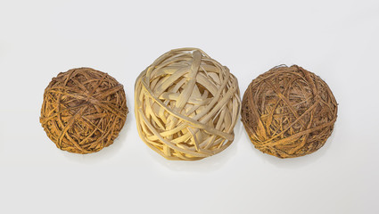 Three decorative wicker wooden balls, white background