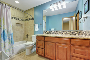 Blue bathroom interior with mosaic back splash