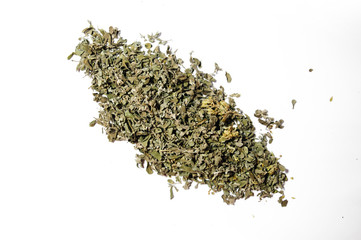 Pile of dried oregano spice on white background