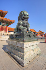 Guardian Lion in front of pavilion at ancient Palace, Beijing, China
