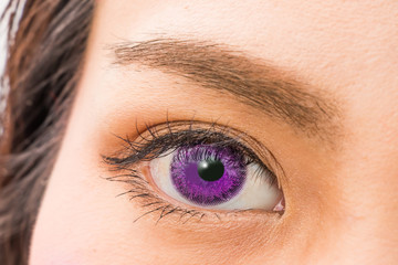 Obraz premium カラコンの女性の片目 woman of colored contact lenses