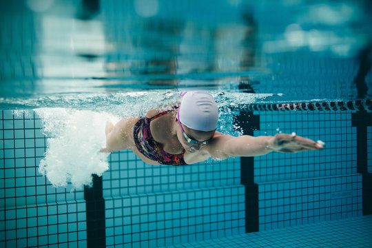 Female athlete swimming in pool
