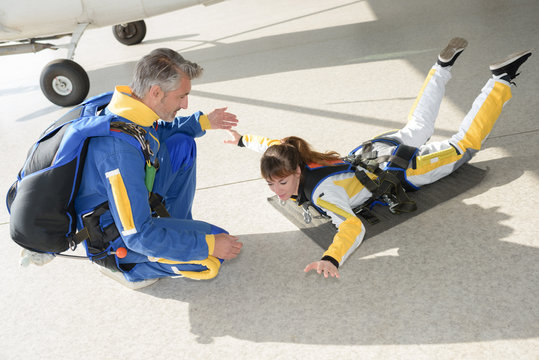 Woman practicing skydiving posture