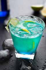 Blue Lagoon Cocktail on Dark Background.