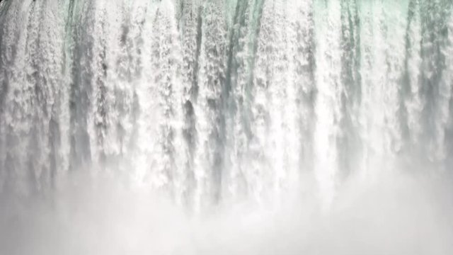 Footage of majestic Niagara Falls on rocky mountain

