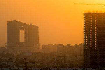 Buildings under construction at dusk 