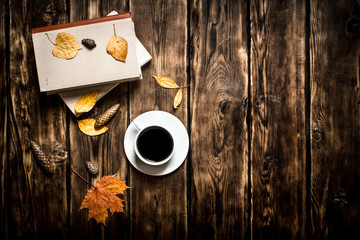 Autumn style. Coffee with an old book.