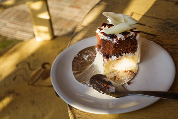slice of coffee cake on dish on the wooden table