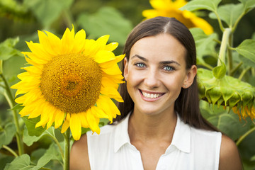 Happy woman with sunflowers