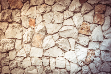 Texture old rock wall made of random stone