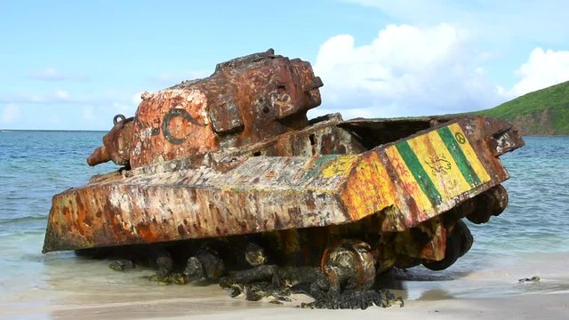 Famous rusty and graffiti covered Sherman tank on popular Flamenco Beach on Puerto Rico island of Isla Culebra in Caribbean Sea