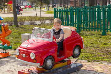 Little boy is riding the car